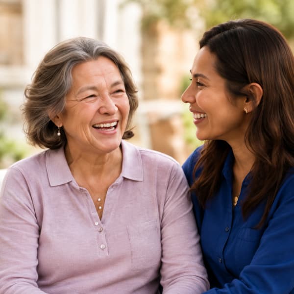Support worker sharing a happy conversation with a participant